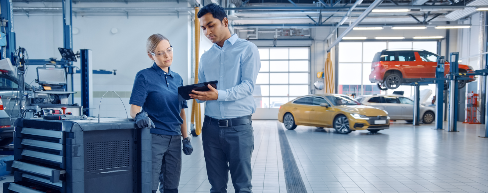 Man and women talking in a workshop