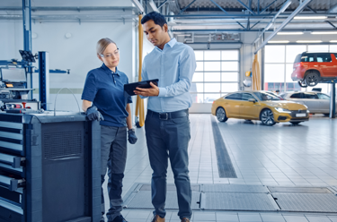 Man and women talking in a workshop