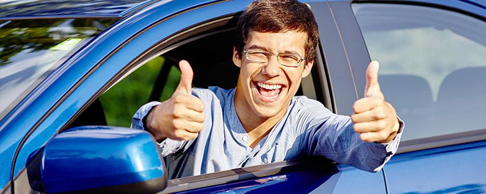 college driver with 2 thumbs up