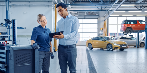 Man and women talking in a workshop