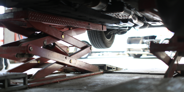 car on lift in garage