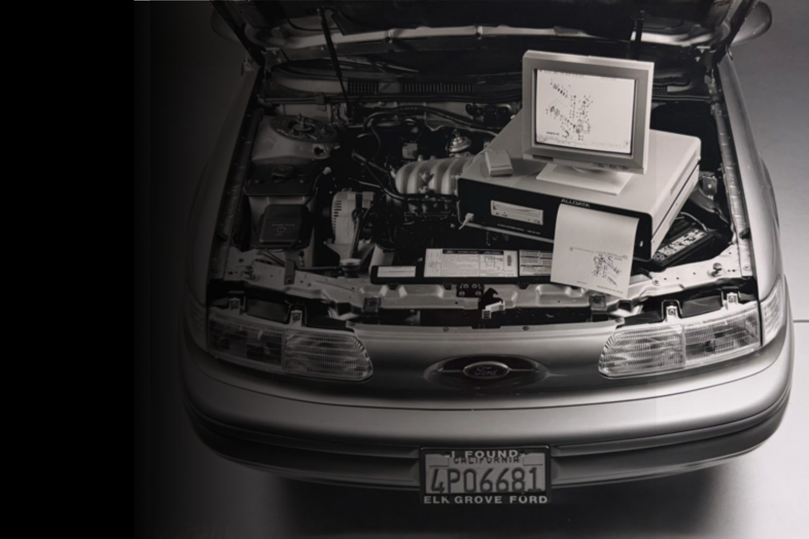 old school computer on a car engine 