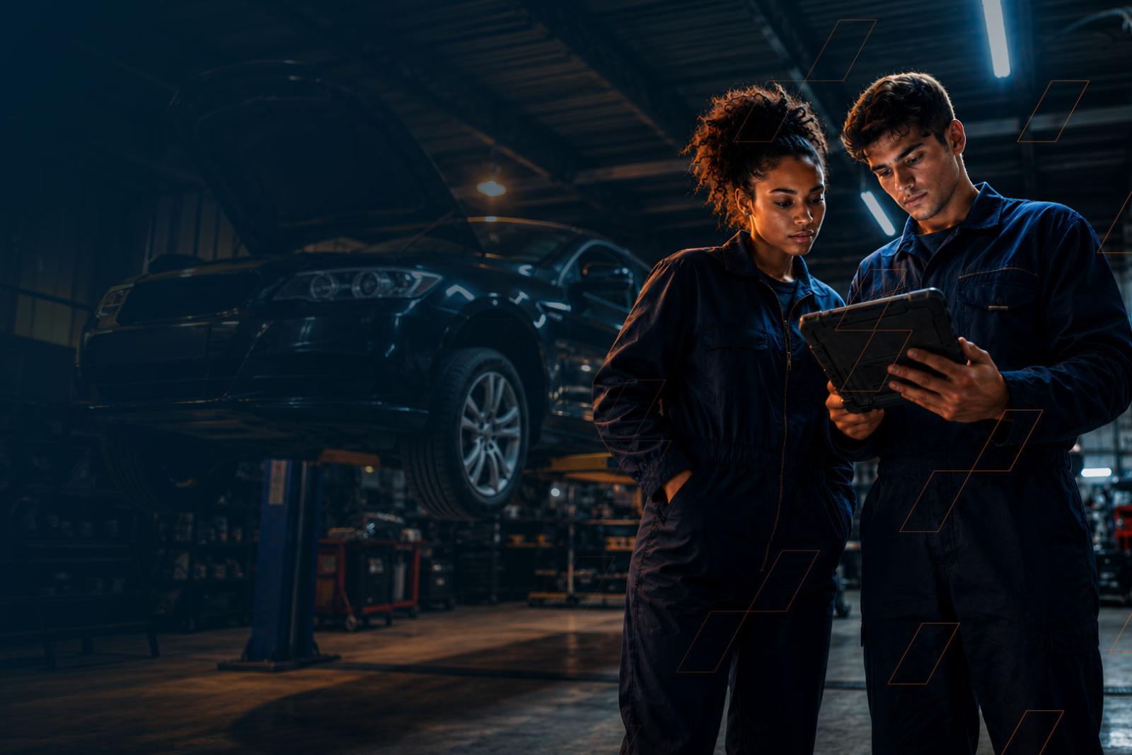 Technicians in workshop on a tablet