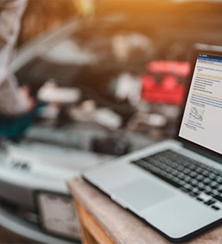 ALLDATAdiy by an open car hood