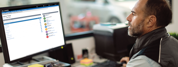Man looking at Labour times on screen 
