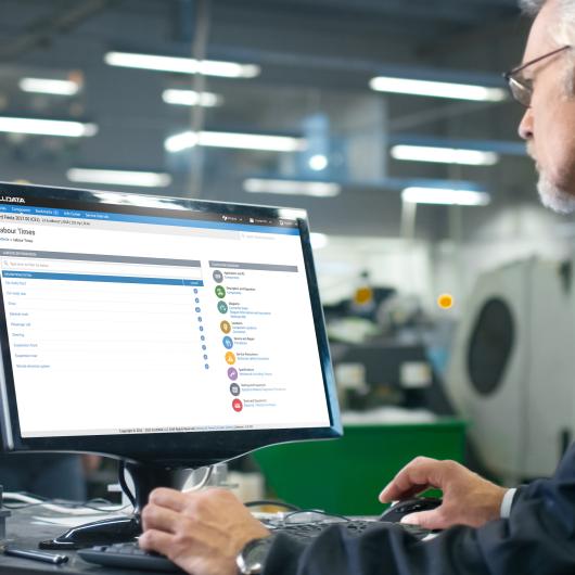 Man looking at Labour times on screen 