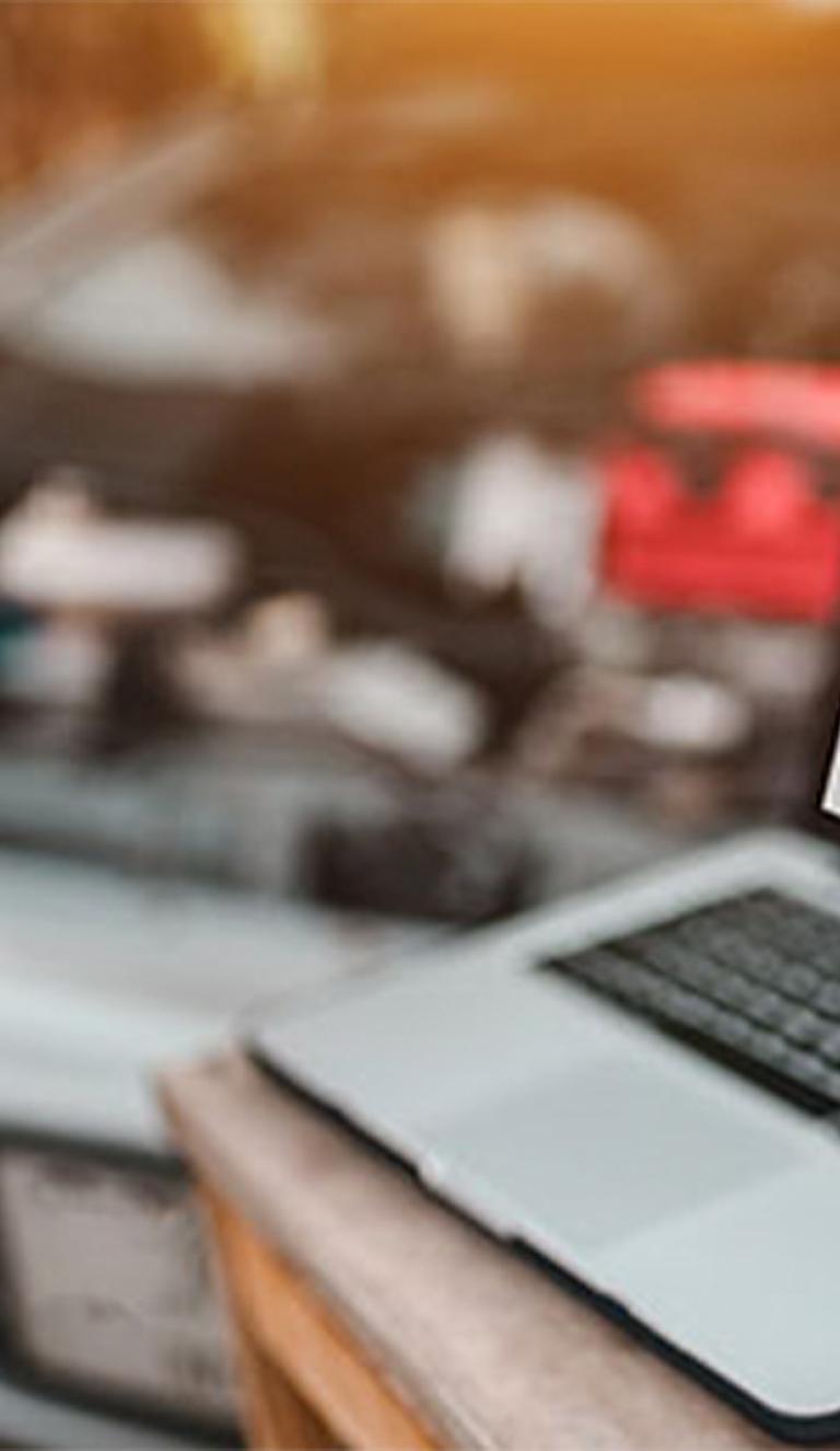 ALLDATAdiy by an open car hood